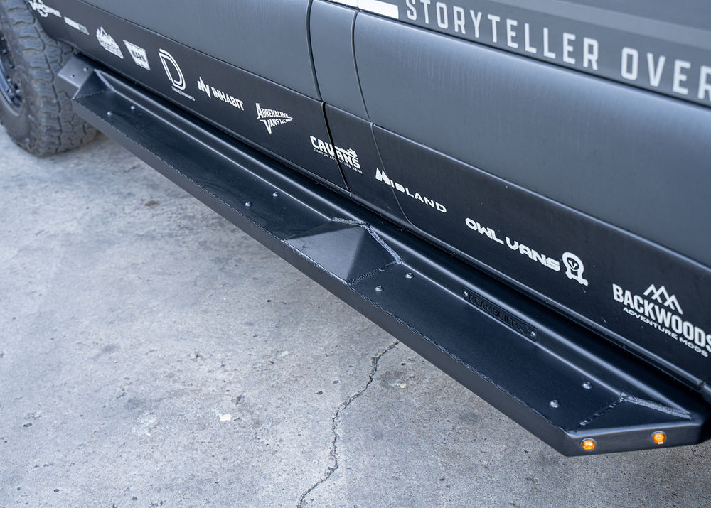 Top view of ROAMBUILT Flat Side Step installed on a Mercedes Sprinter, highlighting the raised grip edge, black textured finish, and integrated lights.