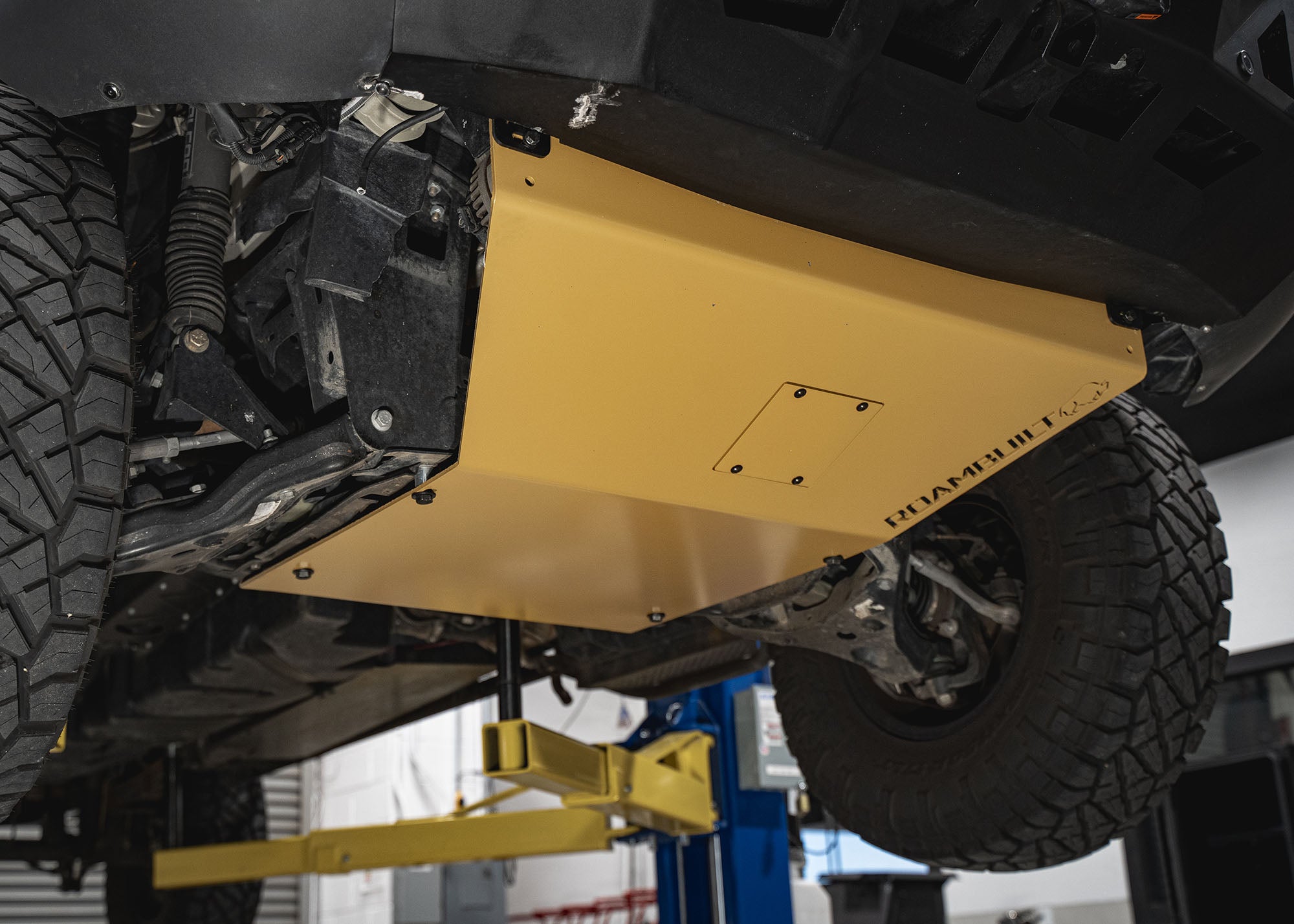 Roambuilt Mercedes Sprinter Skid Plate from the side showing how it connects to the Roambuilt LopPro bumper