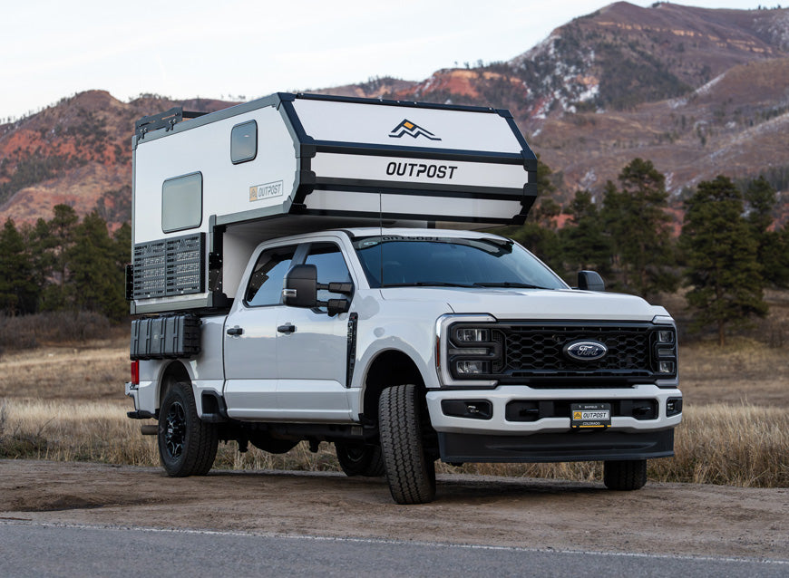 2026 Outpost 6.5 truck camper mounted on a full-size pickup