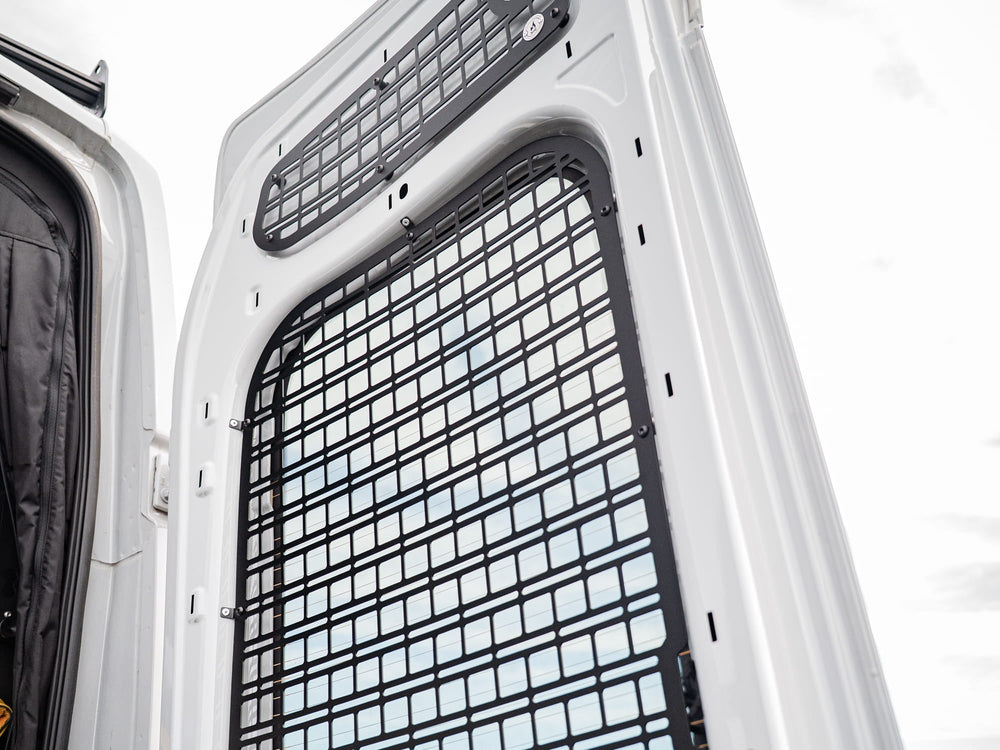 Upper and Rear Door Window panels of the Transit Rear Door Molle Panel installed in camper van