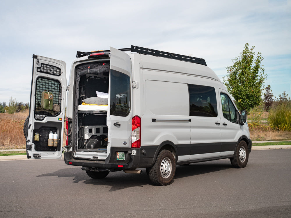 Ford Transit 48" high roof van with FVC Transit Rear Door Molle Panels and FVC Low Pro Roof Rack installed