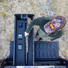 [A0151-PZFM-VXST] A man retrieving his bird hunting gear, including his shotgun and shells, out of his Drawer System's Piecekeeper PuzzleFoam organizer.